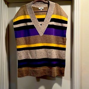 Oversized wool vest made by COS.  Machine washable.  Blend of mixed knitting.